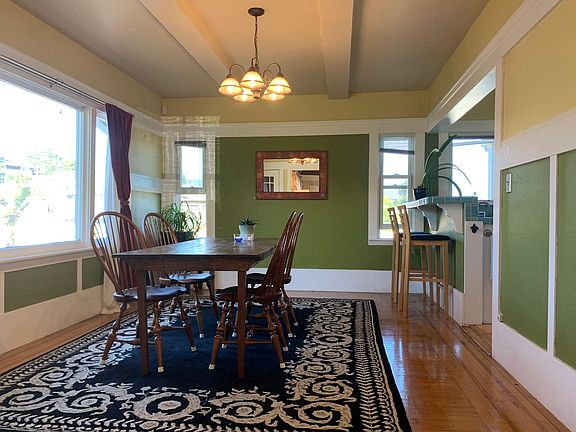 Dining room into the kitchen with bar seating