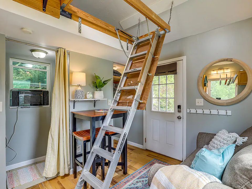 ladder to bed/loft space retracts easily to create space in the living area.