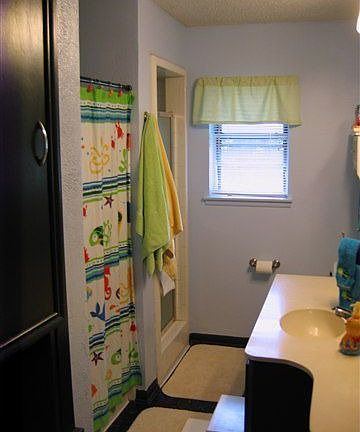 Bathroom 1 of 2 with seperate tube shower
