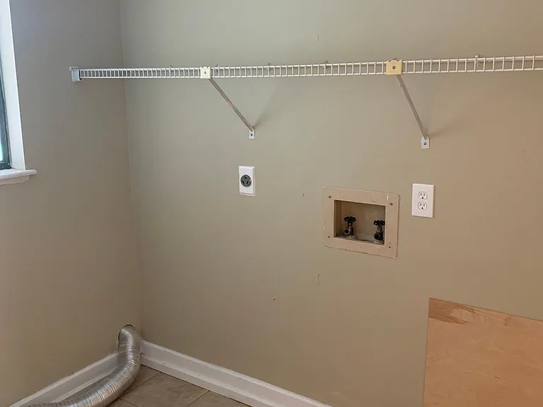 Laundry room with a window