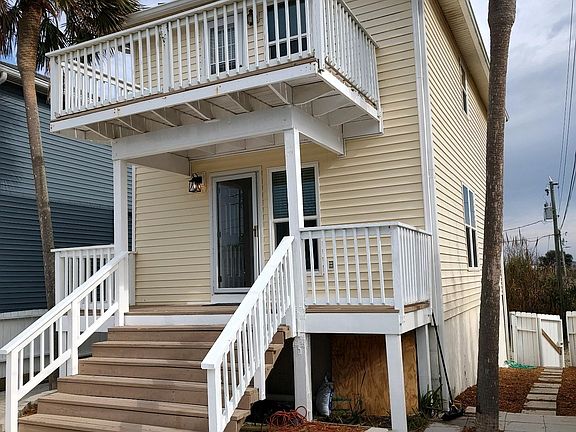 Private courtyard, with fully fenced yard and views of the Gulf and canal next to property.