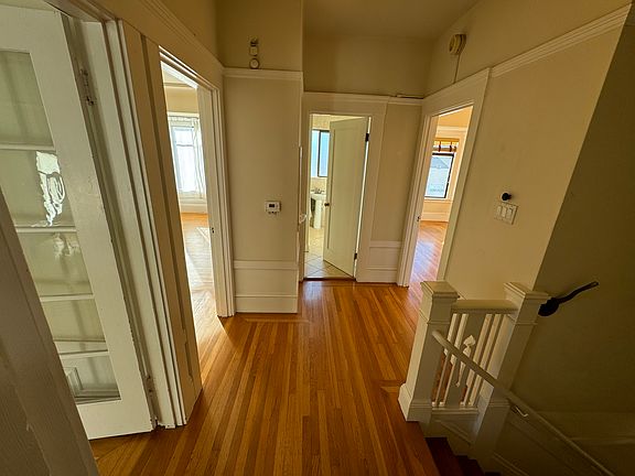 The landing at the top of the stairs provides access to everything. This view is from the kitchen. The stairs are to the right.