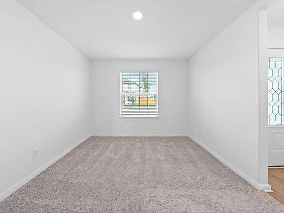 The entry is highlighted by the dining room!