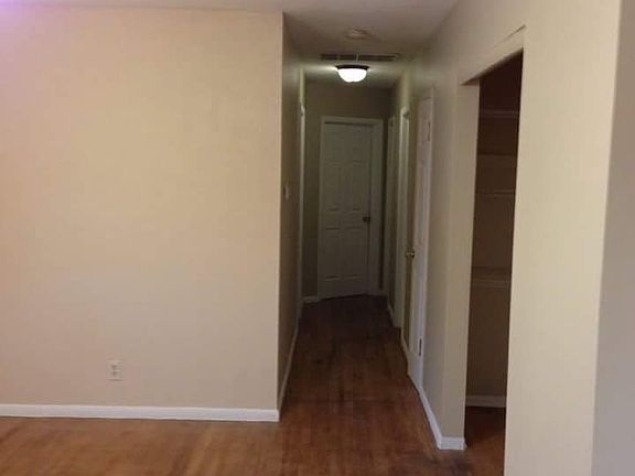 From living room view into hallway leading to bedrooms