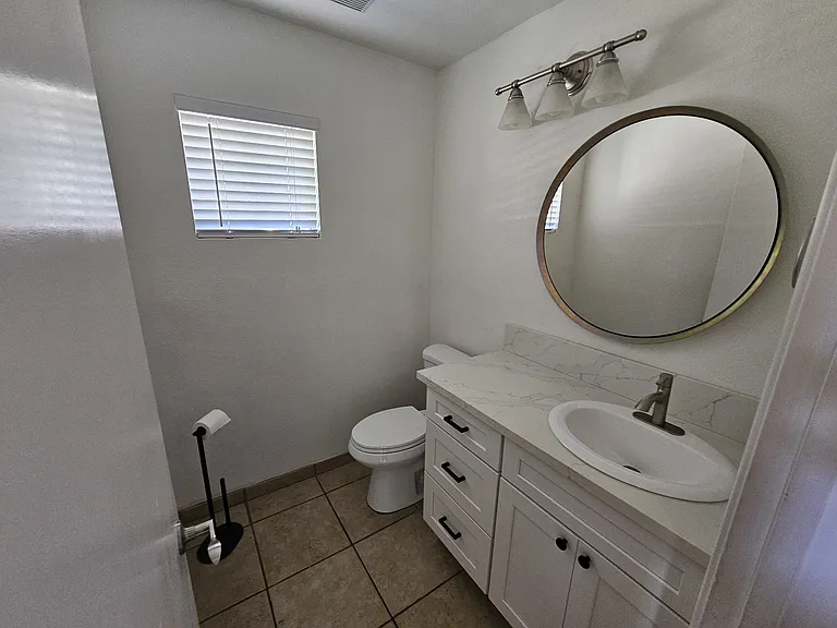 Guest bath downstairs. - new cabinets, counter top, toilet.