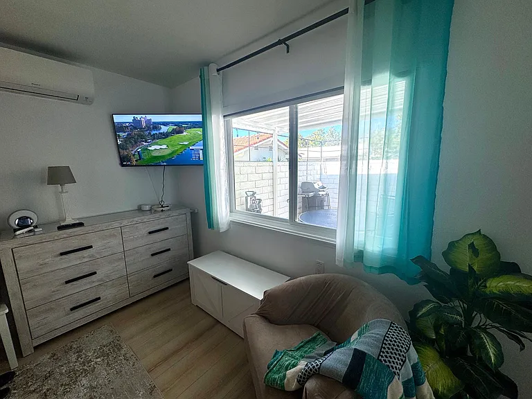 Master Bedroom Sitting Area. Outside- Private Walled in (Great for your dogs) Covered Courtyard with Fountain, BBQ and Dining Table.