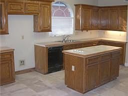 Kitchen floor and countertops recently updated with Tile