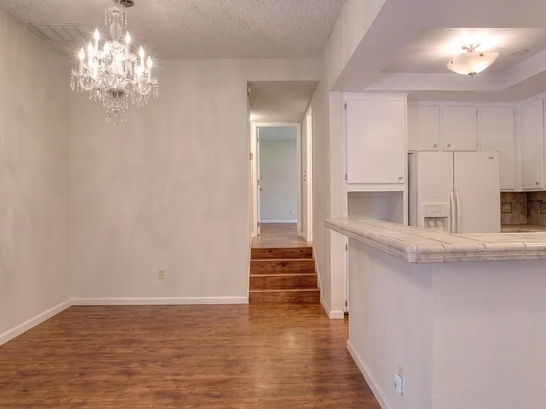 Dining room, Kitchen. Picture from previous listing. Chandelier in dining room has been replaced