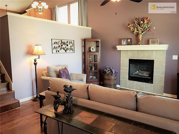 Great room with wonderful light, hardwood floors, and direct vent fireplace.