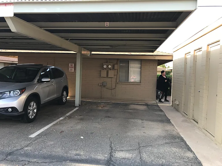 covered parking spot and storage closet