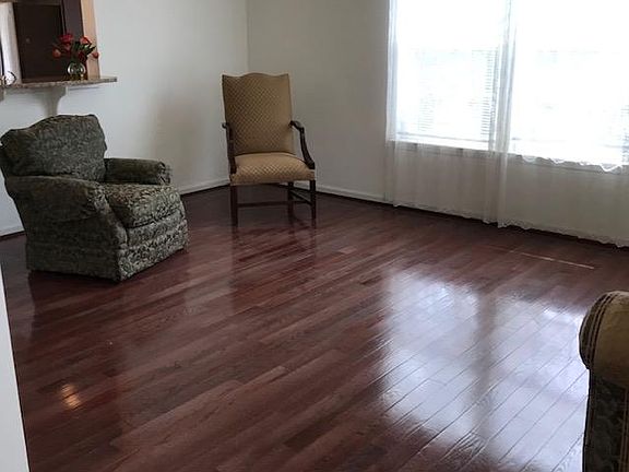 One side of Living room with 4 windows