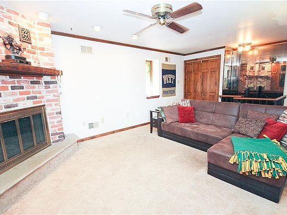 Living room with cedar lined closet.