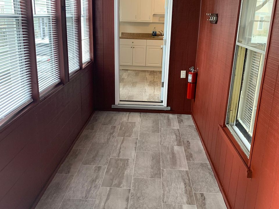 Entrance through enclosed porch