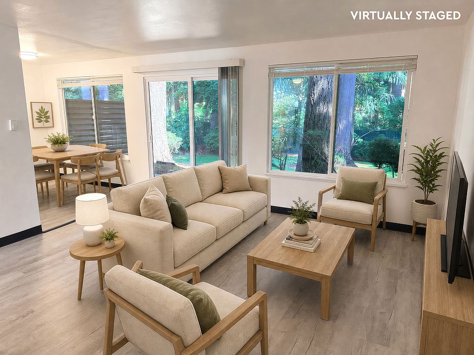 Bright living room with a large window and plenty of natural light.