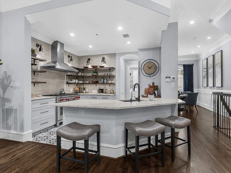 Gourmet kitchen featuring a spacious breakfast bar and professional appliances.