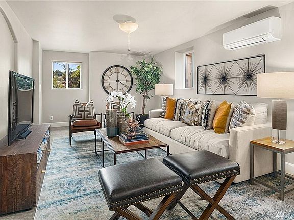 Living Room - Unit has A/C and in-wall electric heating. Fresh paint throughout unit.