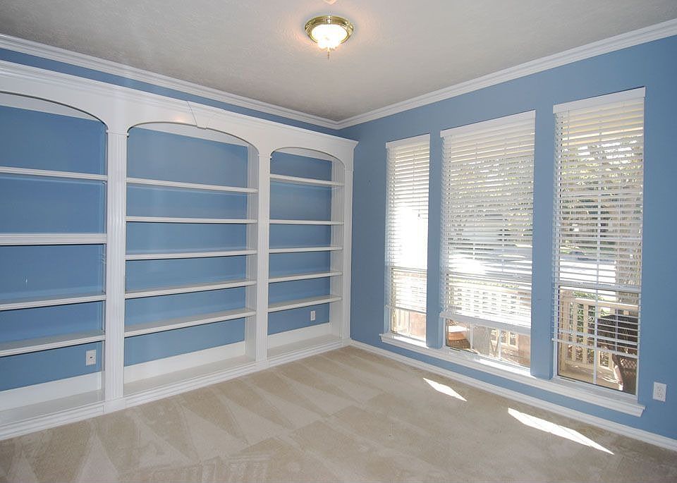 Custom built ins in this bright cheery home study!  French door entry 