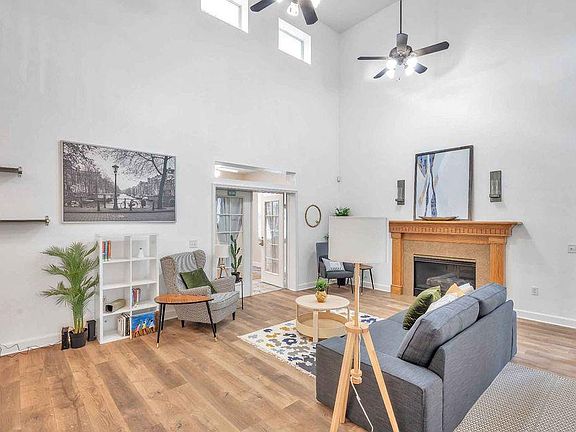 VAULTED CEILING IN THE GRAND FAMILY ROOM, OPENS TO SUNPORCH/POOL AREA
