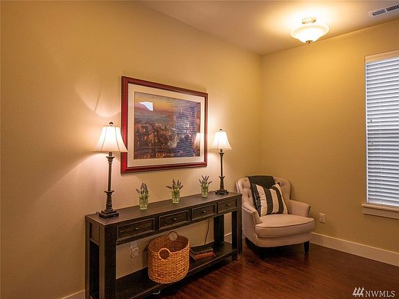 Main level entry welcomes guests to stay awhile. Laminate hardwoods throughout most of the home.