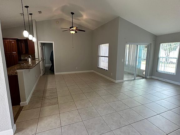 Living area, dinner room on the upper left corner, and closed back porch on the right back corner