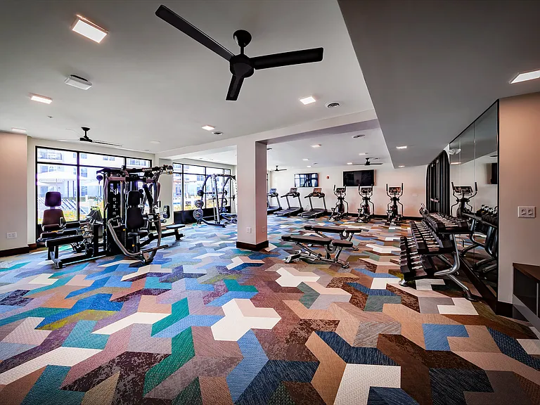 24-hour fitness center with cardio equipment, strength-training machines, and free weights for convenient on-site workouts.