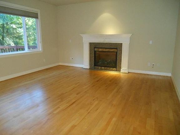 Family Room with Gas Fireplace adjoins Kitchen and informal dining area.