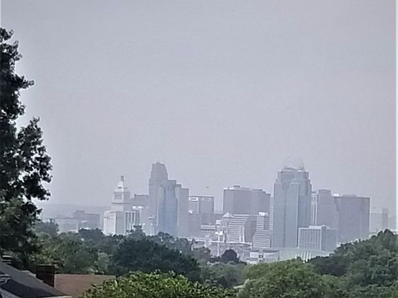 overcast view of city of Cincinnati from the living room and bedroom of apartment