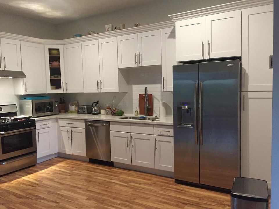 Kitchen includes refrigerator, range and dishwasher