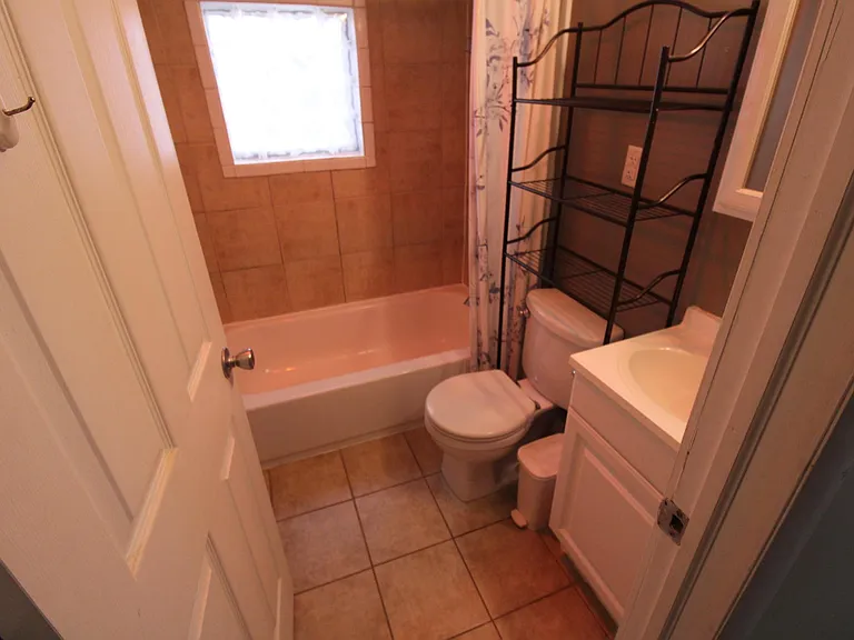 Upgraded Bathroom with wall and floor Tile for your comfort.