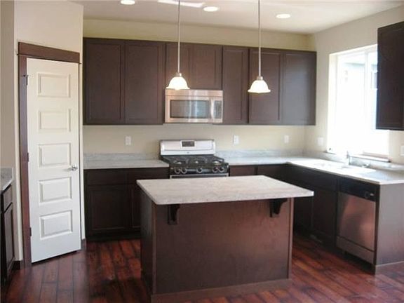 island kitchen with slab counters