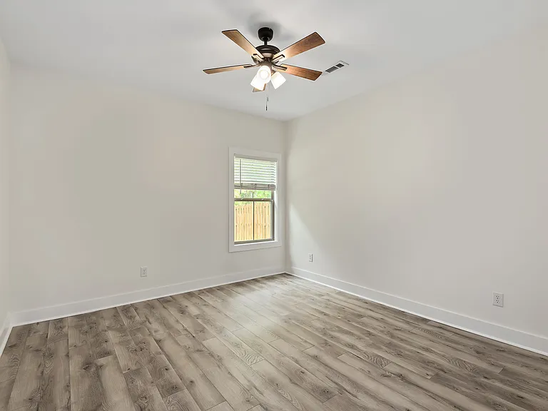 Guest bedroom/office space with backyard view