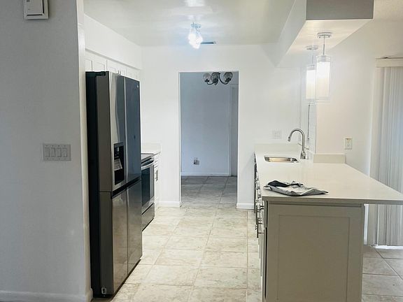 Renovated kitchen. Brand new stainless steel appliances, quartz countertops & cabinetry