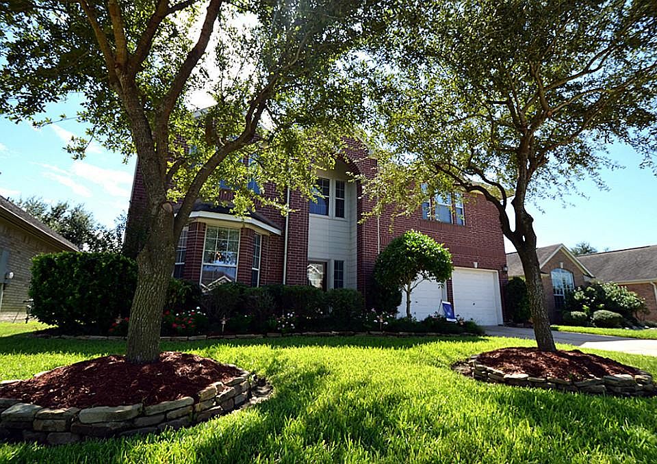 Beautiful home in a wonderful neighborhood framed with two mature trees and stunning curb appeal.