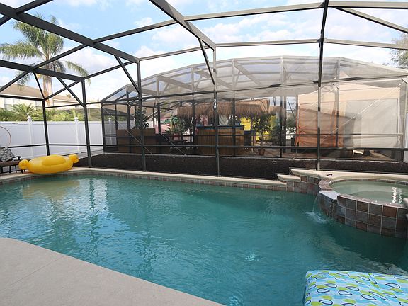 caged heated pool & hot tub