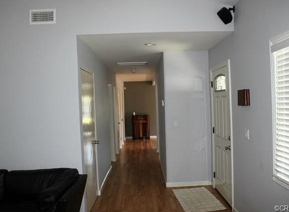 Hallway from living room to bedrooms and family room/ kitchen