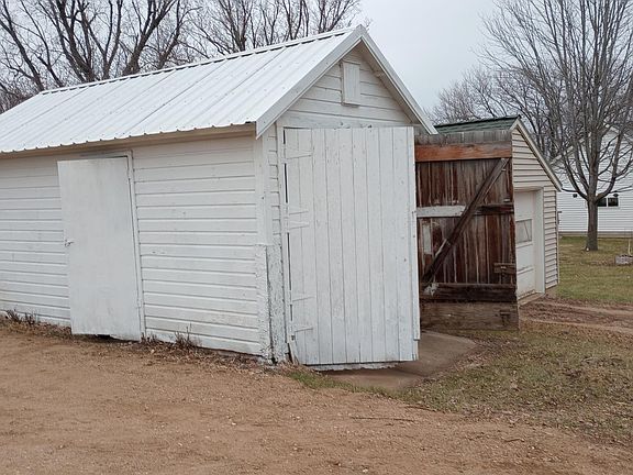 Just a one-car garage. Swinging doors to open. Some extra space here, too.