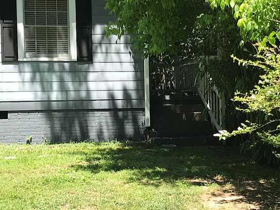 Private entrance to apartment with nice porch with sitting area.