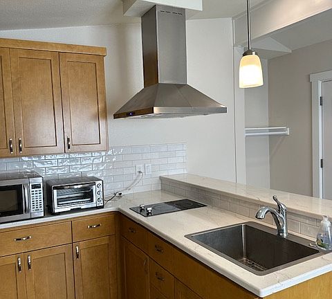 ventahood over the cook top. Plenty of storage-View of the area to hang coats etc, at the front door