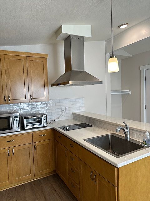 ventahood over the cook top. Plenty of storage-View of the area to hang coats etc, at the front door