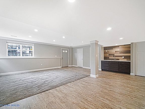 lower level just finished - wet bar - walk out - bath - storage area