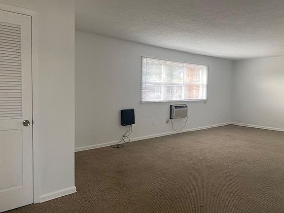 The Apartment living room has a walk-in closet space.