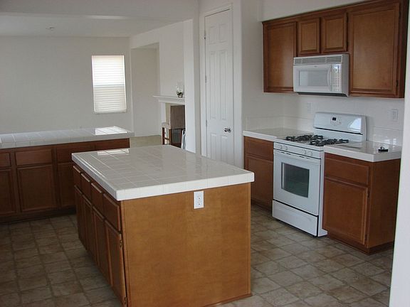 BEAUTIFUL KITCHEN w/ISLAND, BUILT-IN DISHWASHER, MICROWAVE,RANGE, TILE FLOORIN