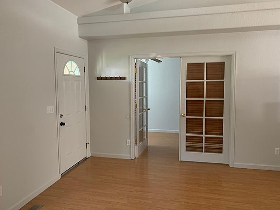 Entry Way and office. Fire place behind photographer.
