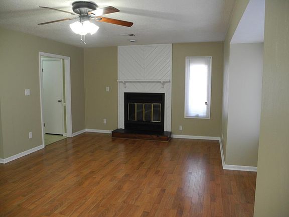 Note: Fireplace now replaced with electric fireplace with connections for tv above. Rooms painted light creamy color for more light. Light and roomy living and dining area