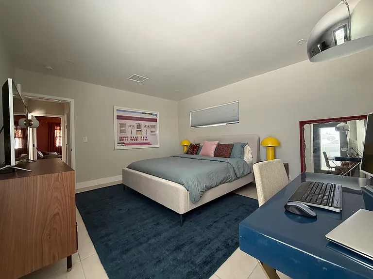 Primary bedroom w/ TV and desk for WFH (w/ monitor)
