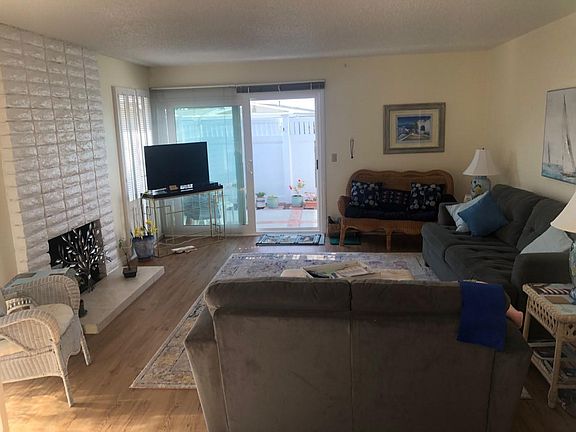 living room with fireplace and private patio!!