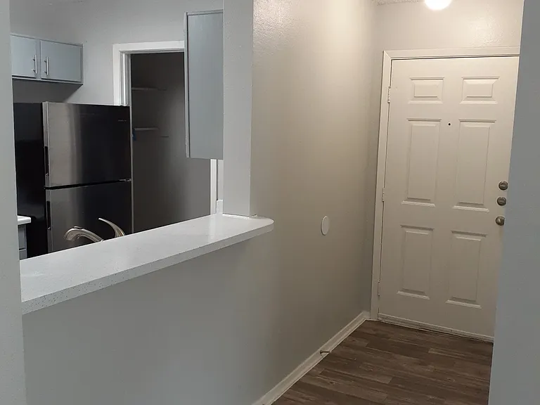 Upgraded Apartments with Faux Harwood Floor Front Door Thresholds