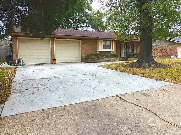 Front view with double-wide driveway