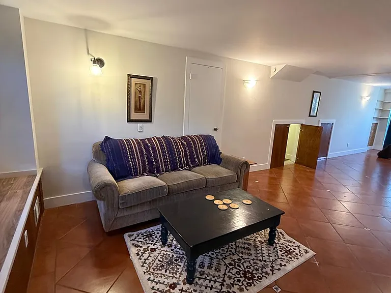 Living space has double-doors leading to storage area