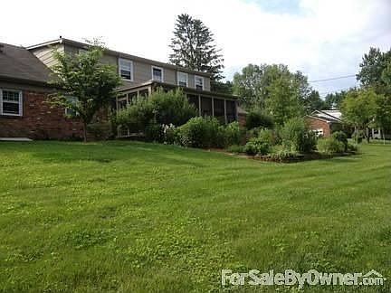 Backyard view
						:
						Shows back porch, gardens, upstairs, and degree of slope of back yard